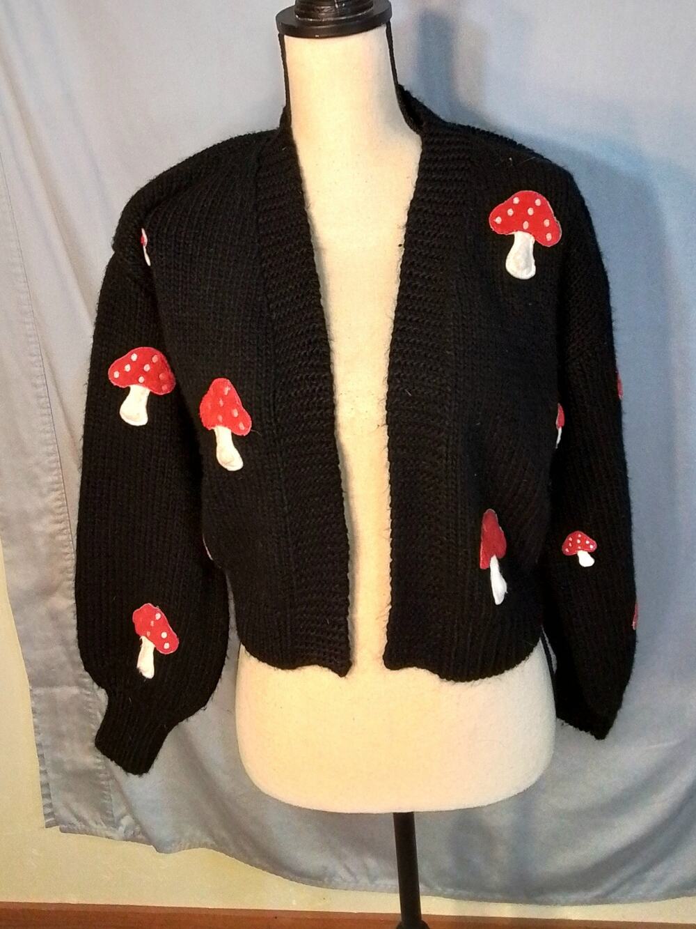 Forever 21 black sweater with red mushrooms.